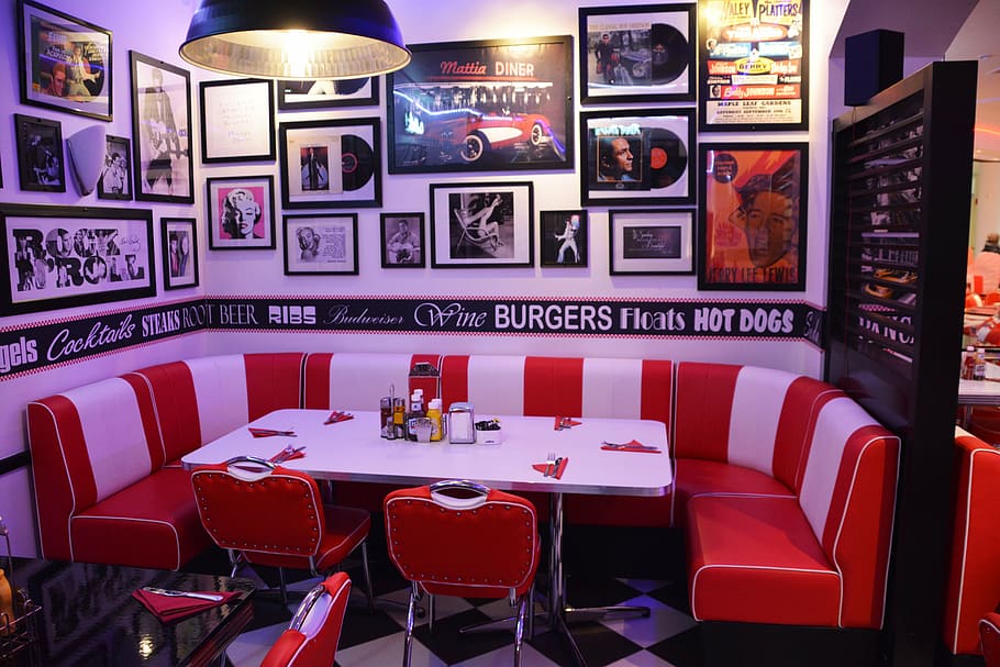restaurant interior with paintings, corner table, cafe, american diner