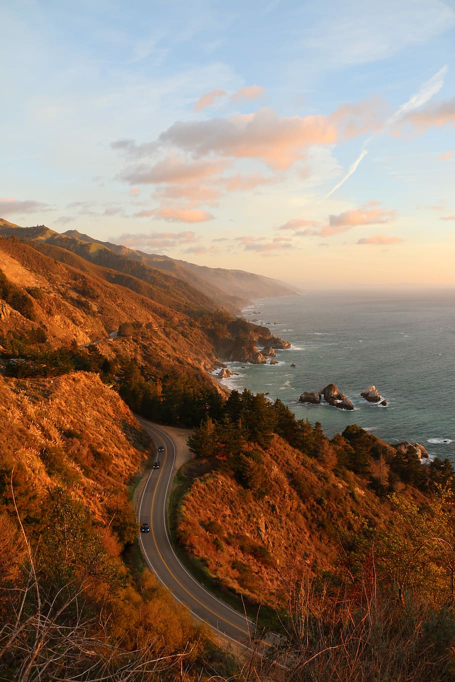 three cars on concrete pavement beside mountain, sea, nature HD wallpaper