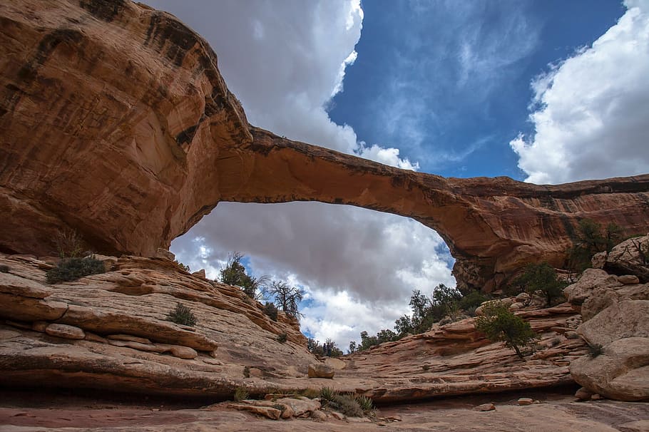 worm's-eye view of rock formation under cloudy sky, owachomo bridge HD wallpaper
