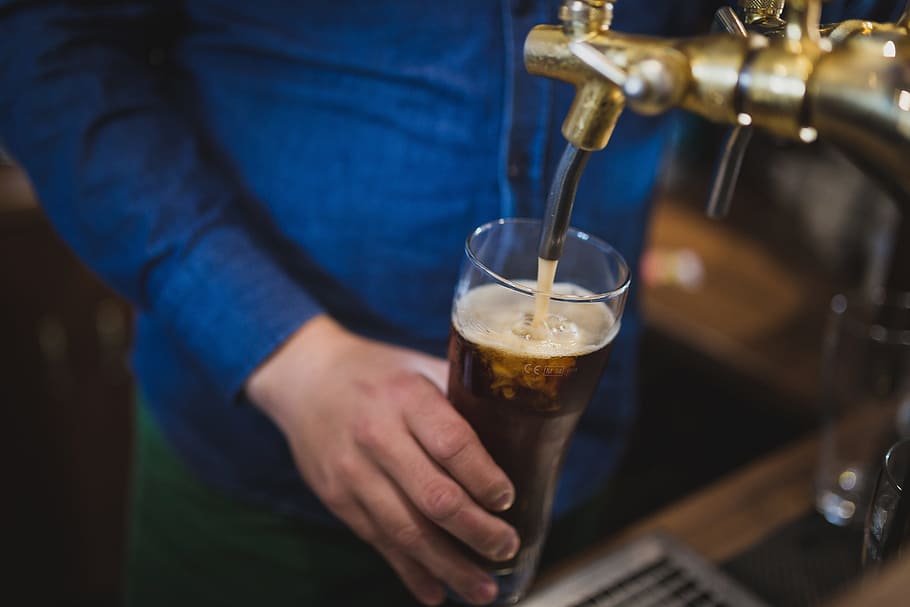 person holding drinking glass while filling liquid in it, beer HD wallpaper