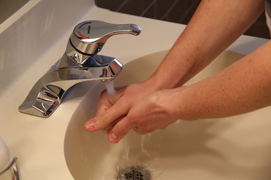 person washing hands on faucet, sink, water, hygiene, clean, soap