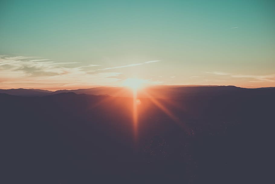 silhouette of mountain with sun lens flare, highland, clouds HD wallpaper