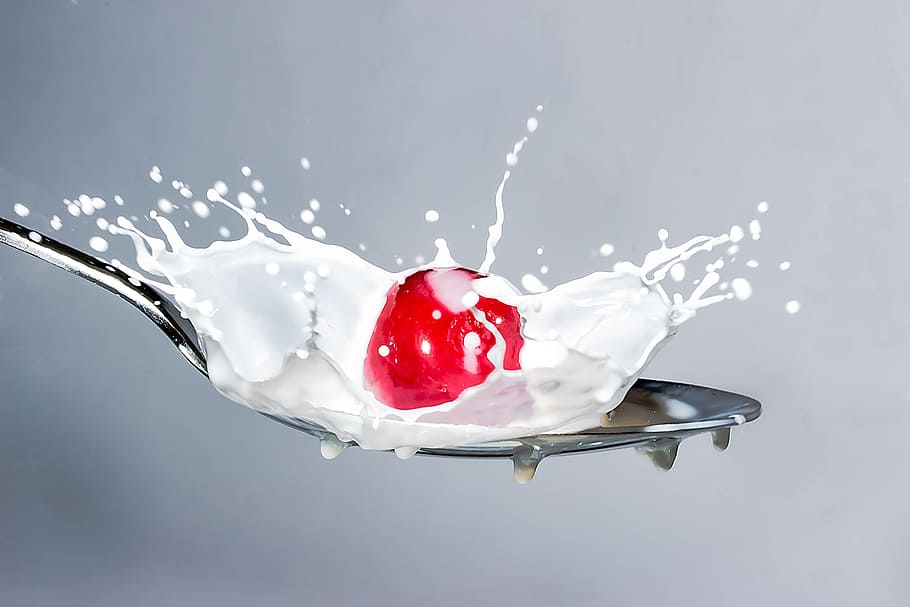Close-up of Red Splashing Water Against White Background, blur HD wallpaper