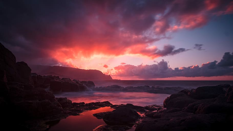 landscape photo of body of water in sunset, rock formation near seashore during sunset HD wallpaper