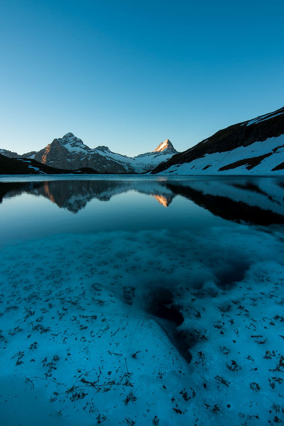 body of water near mountain under blue sky during daytime, body of water near snow-covered mountain during daytime HD wallpaper