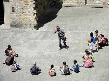 people on street sitting and standing during daytime, man, front HD wallpaper