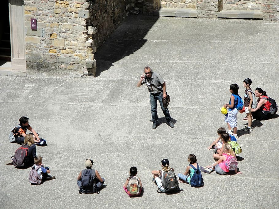 people on street sitting and standing during daytime, man, front HD wallpaper