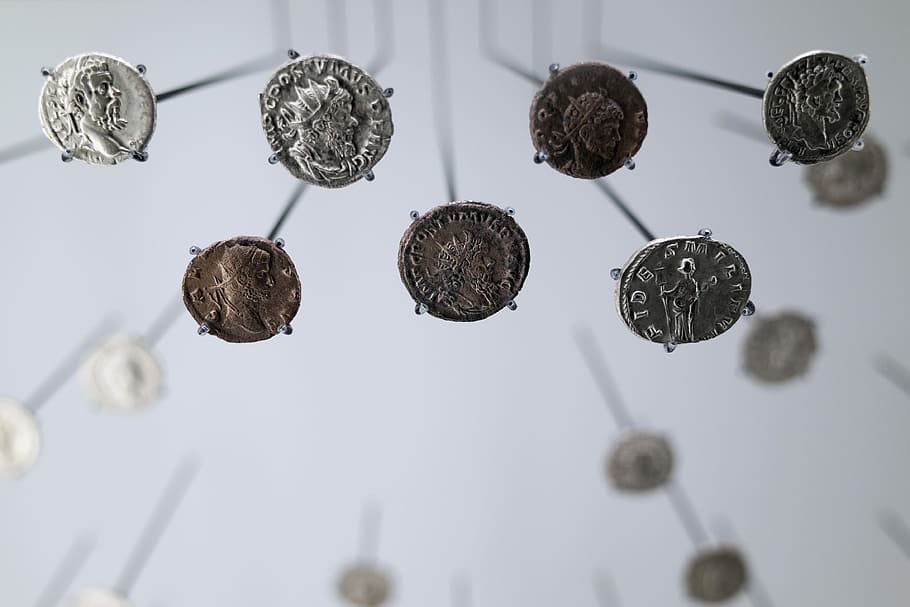 Coins, closeup photo of seven assorted-denomination coins, roman