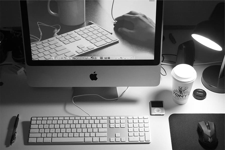 grayscale photography of iMac beside Apple Magic keyboard on desk HD wallpaper