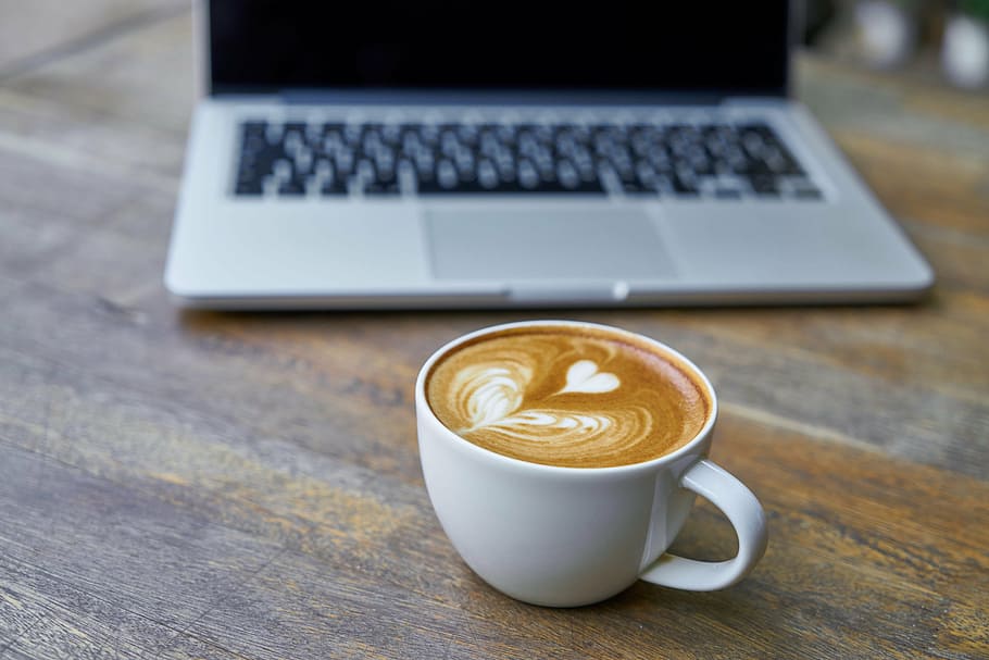brown coffee espresso in white ceramic coffee mug on brown wooden top HD wallpaper