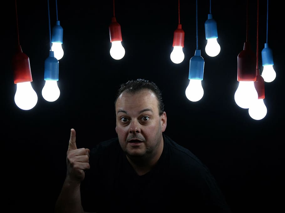 man pointing up with light overhead, light bulbs, pears, show HD wallpaper