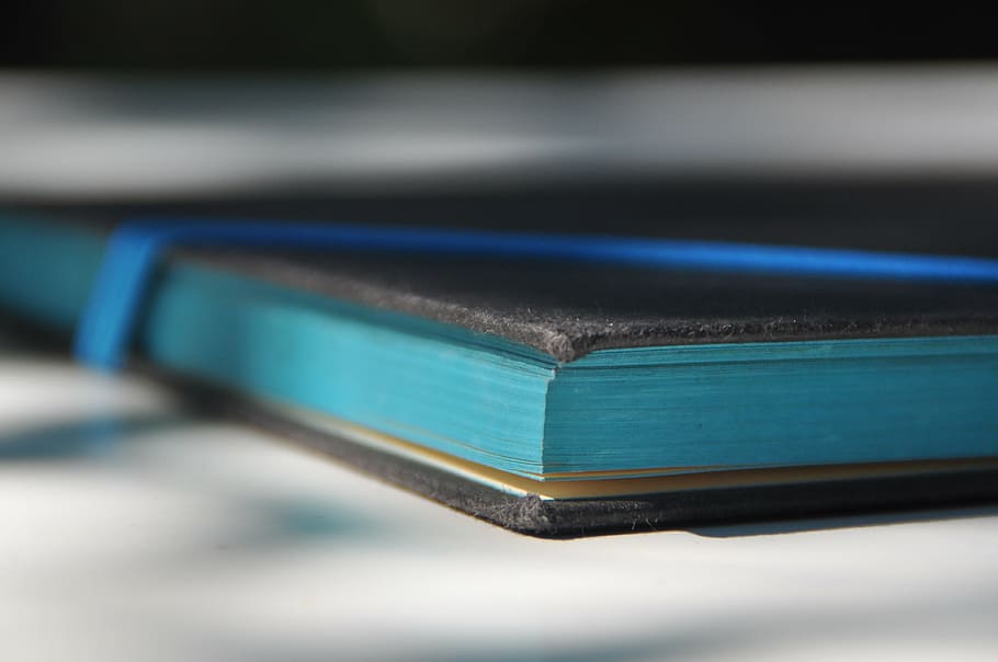 closeup photo of black and blue book, pages, turquoise, literature HD wallpaper