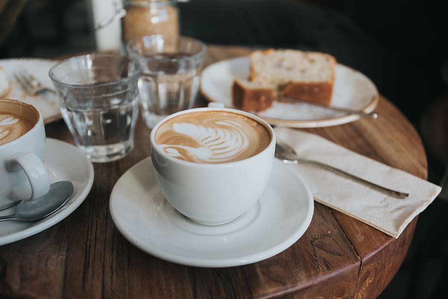white ceramic mug on white ceramic saucer on brown wooden table, photo of breakfast settings on table HD wallpaper