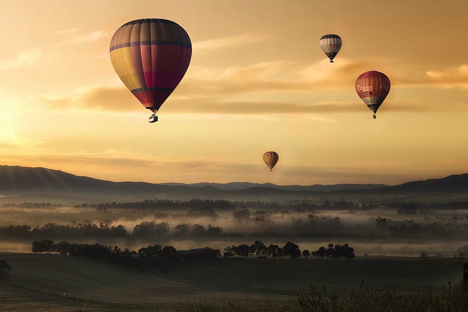 several hot air balloons above ground photo, valley, sky, yellow