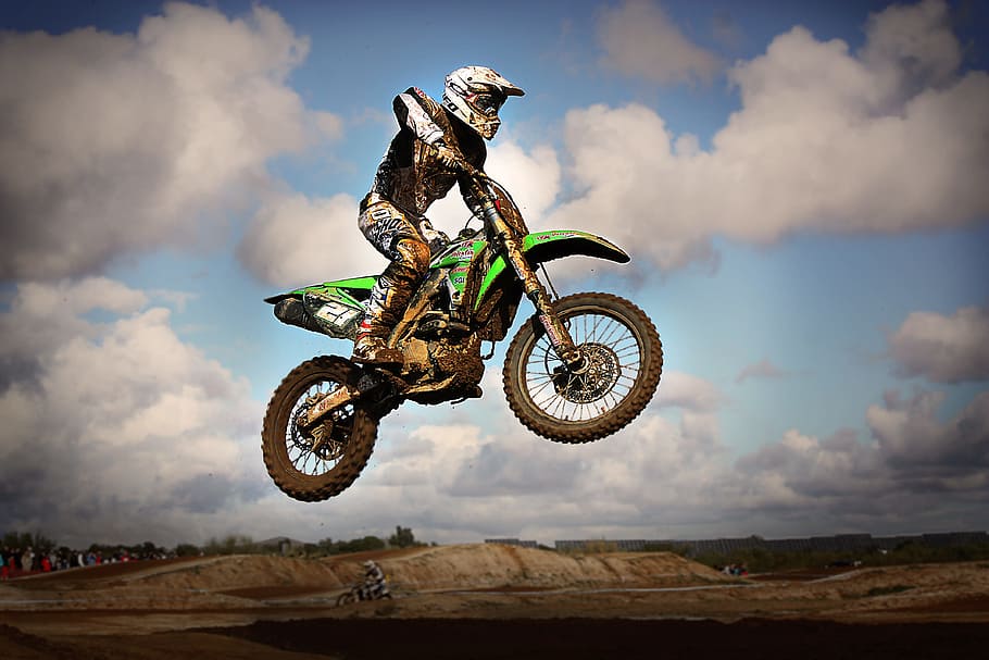 HD wallpaper: man riding motocross dirt bike, jump, motorcycle, speed, brown | Wallpaper Flare