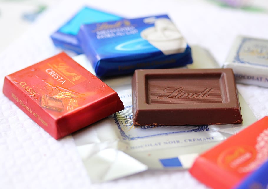 chocolate bar on white surface, sweet, snack, close-up, no people HD wallpaper