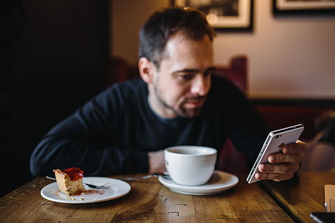 Young Elegantly dressed man sititng in a cafe, caucasian, interior HD wallpaper