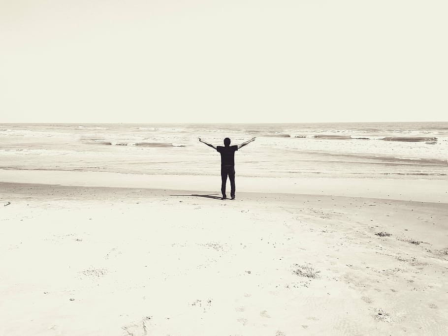 man rising hand standing on seashore at daytime, beach, worship