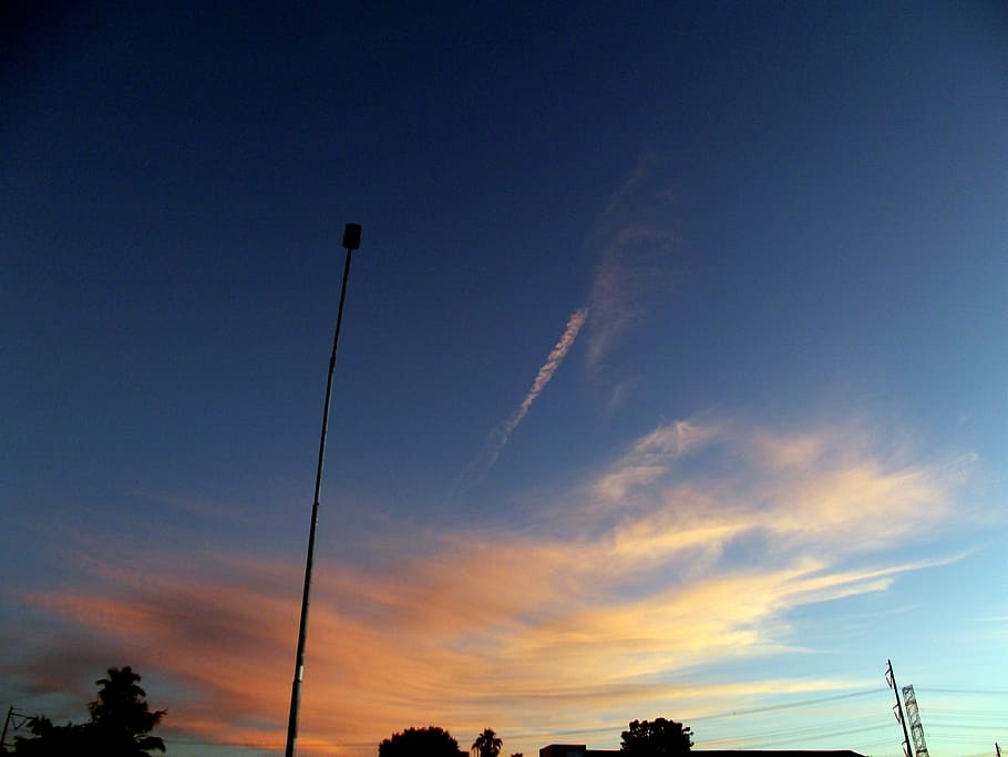 sunset, glow, orange, sky, clouds, streetlight, pole, silhouette HD wallpaper