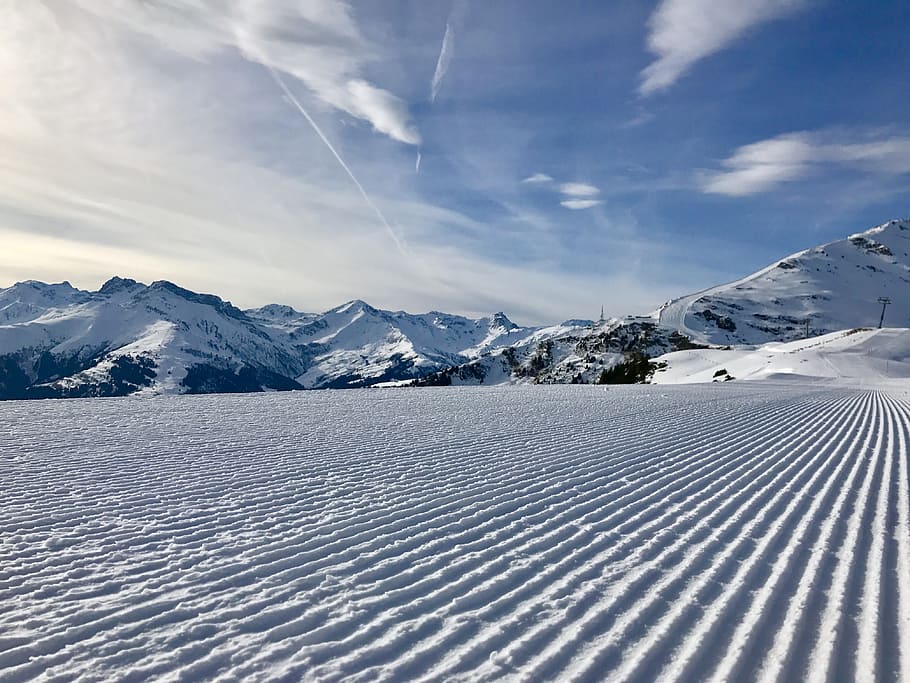 snowland near mountains at daytime, landscape photography of snow coated ground and mountains HD wallpaper