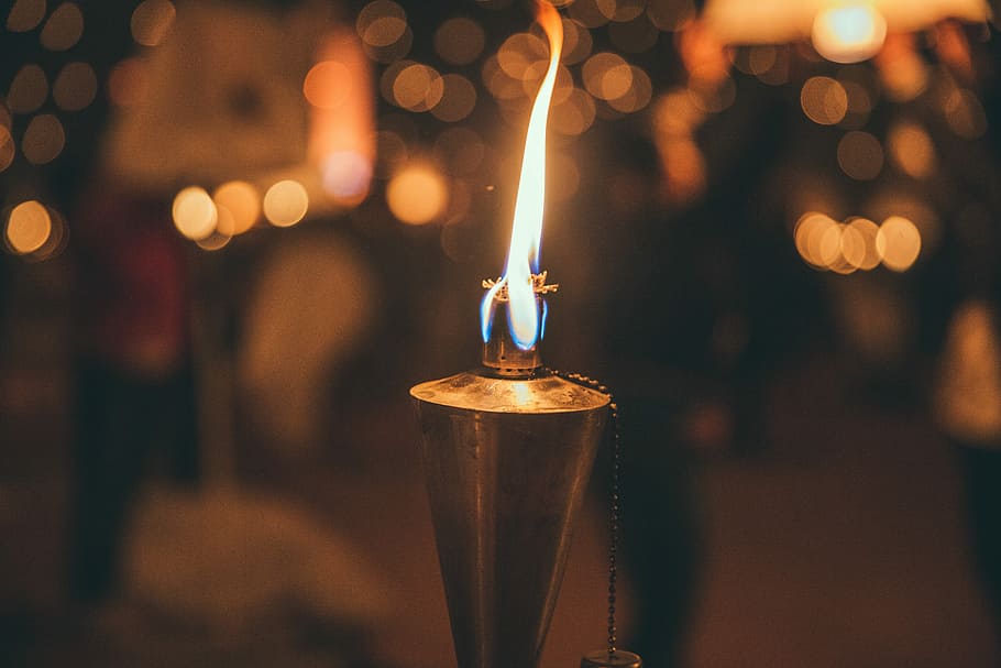 selective focus photography of torch