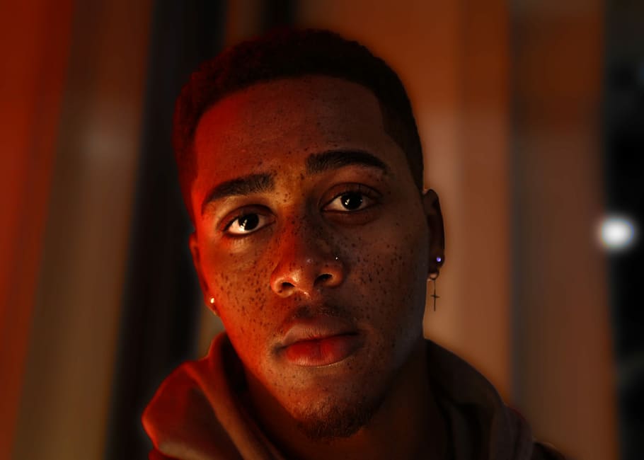 men's red hooded jacket, closeup photo of man with cross earring HD wallpaper