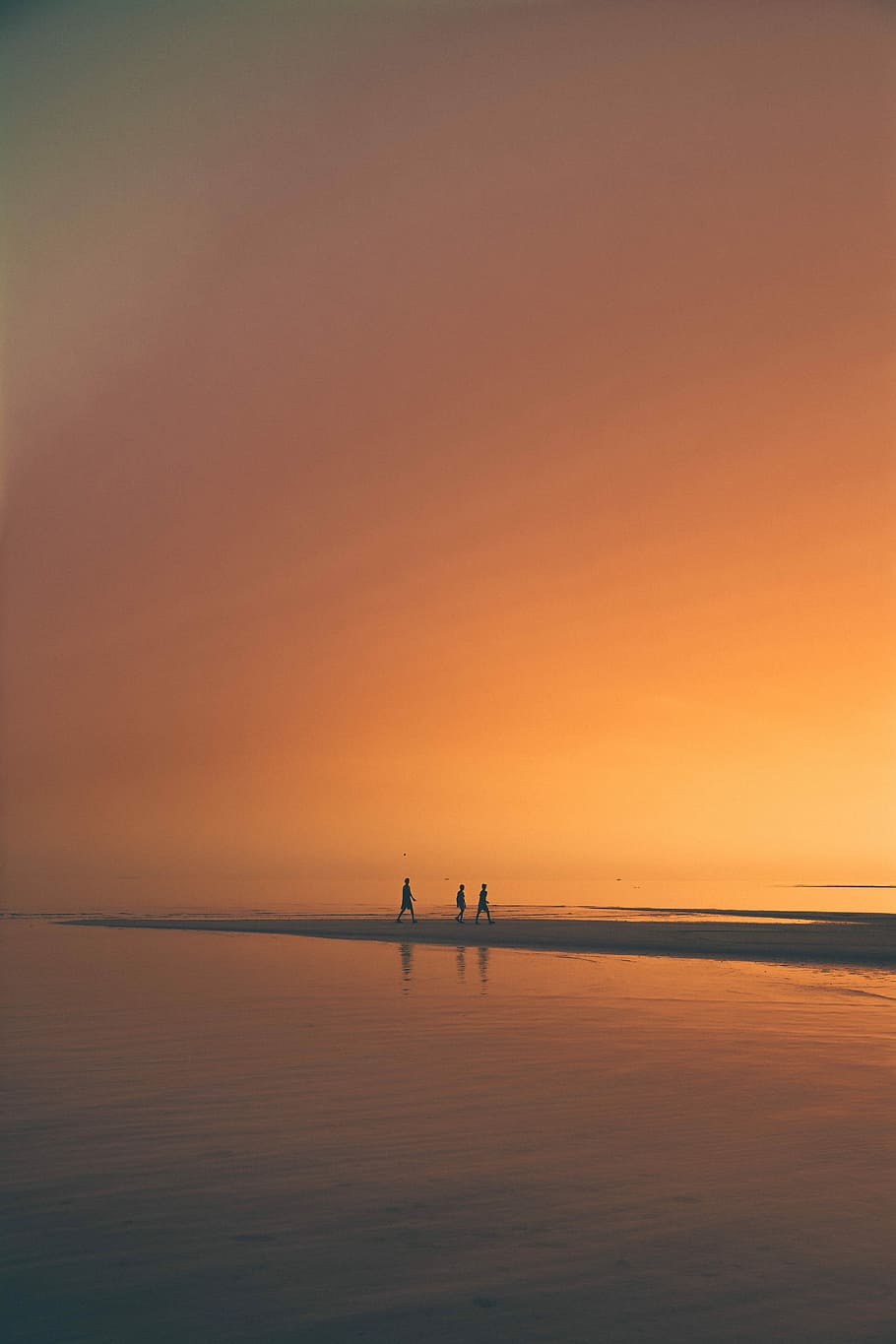 silhoutte of three person on beach, three person walking in the sand beside the beach during sunset, HD wallpaper