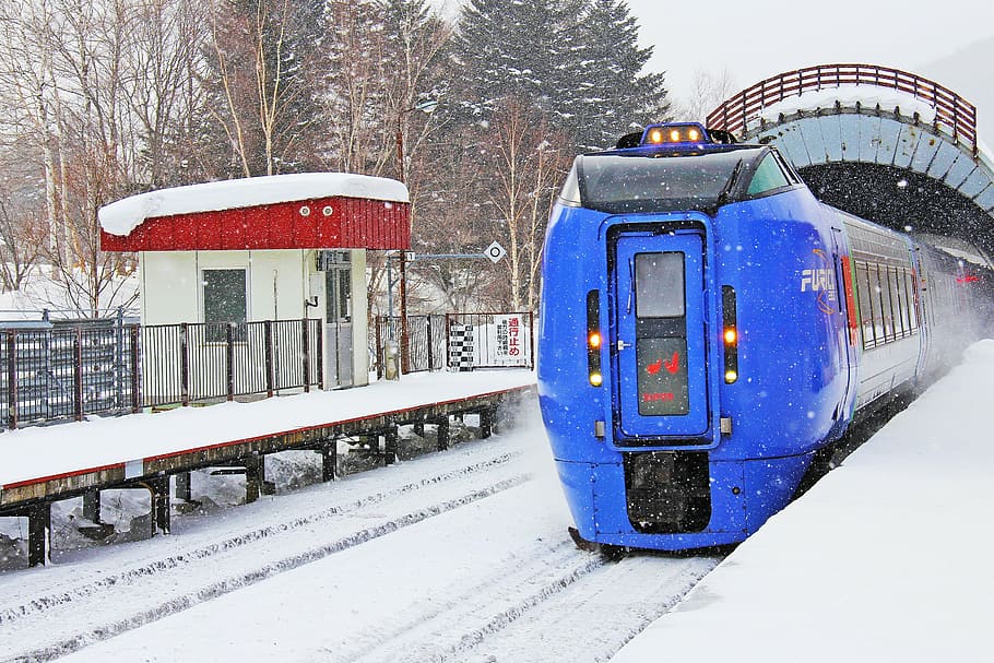 blue and black train with snow covered ground during daytime photography HD wallpaper