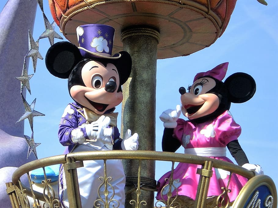 Disney Mickey and Minnie Mouse mascots under blue sky, Torque