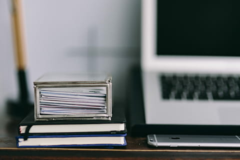 Elegant workspace with Macbook, iPhone, business cards and notebooks HD wallpaper