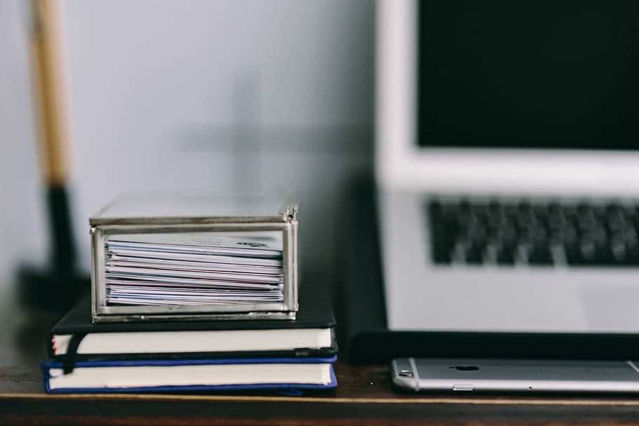 Elegant workspace with Macbook, iPhone, business cards and notebooks HD wallpaper