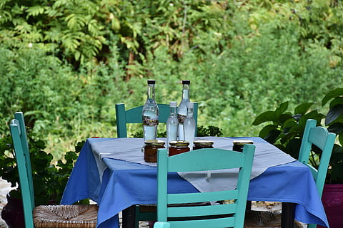 clear glass bottles on wooden table, restaurant, chairs, eat HD wallpaper