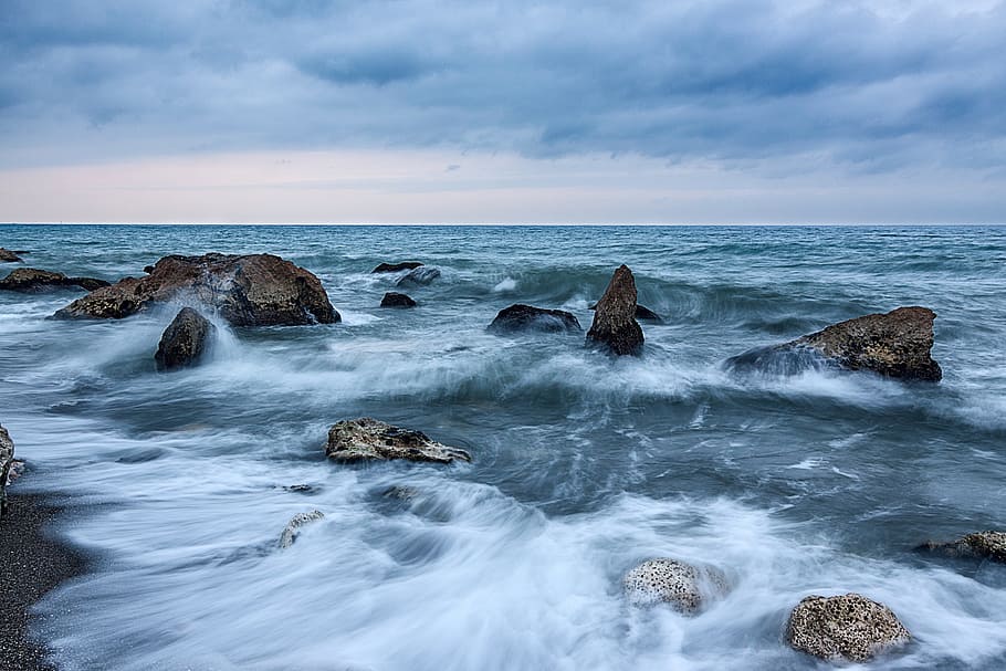 long exposure photography of water waves and stones at daytime HD wallpaper