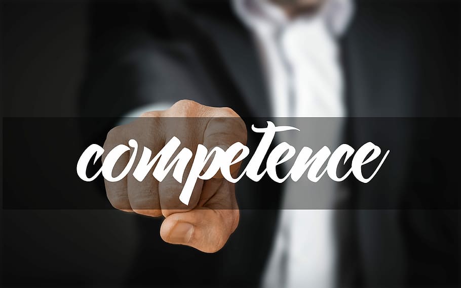 person pointing towards competence word, experience, flexibility HD wallpaper