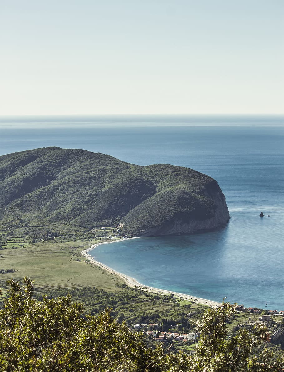 mountain near body of water during daytime, bird's eye view of sea HD wallpaper