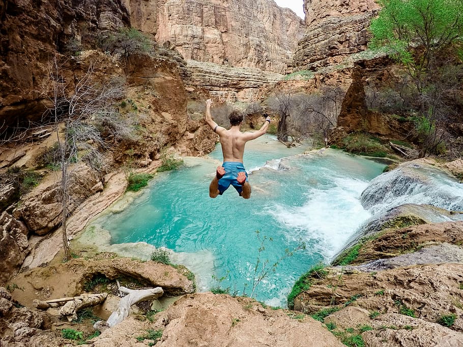 time lapse photography of man jumping on waterfalls, man jumping on mountain, HD wallpaper
