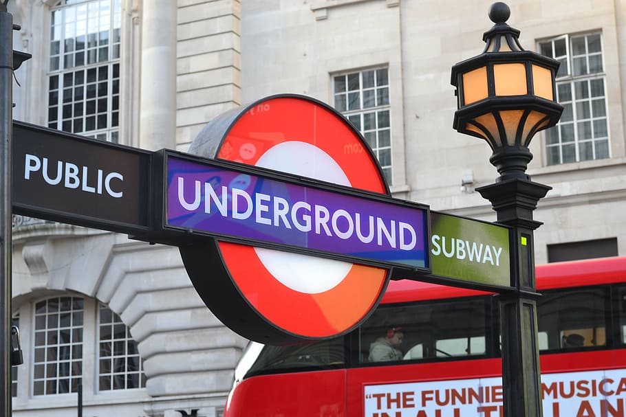 Underground Subway signage beside brown concrete building during daytime HD wallpaper
