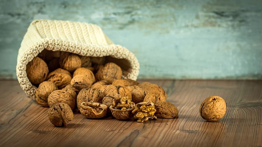 bunch of brown nuts, walnuts, dump, spill, bag, table, still life HD wallpaper