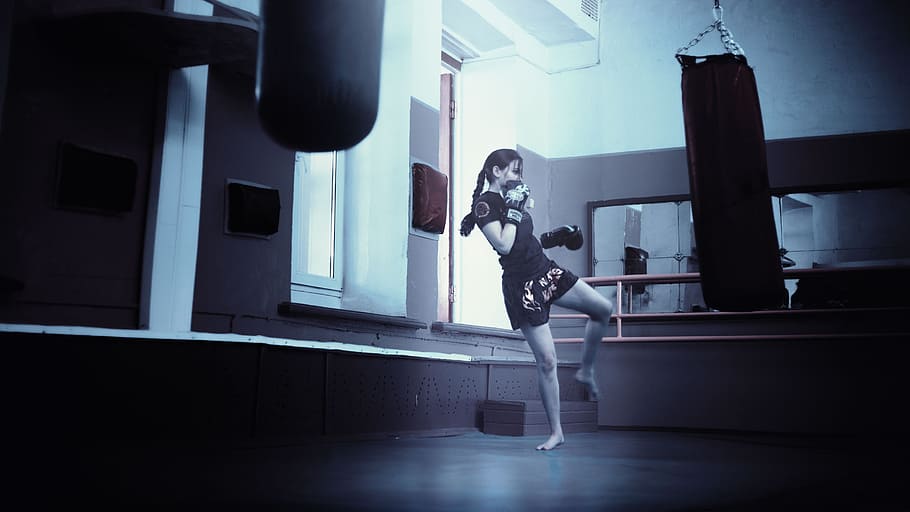 woman kicking black heavy bag, kickboxer, girl, kickboxing, athletic girl
