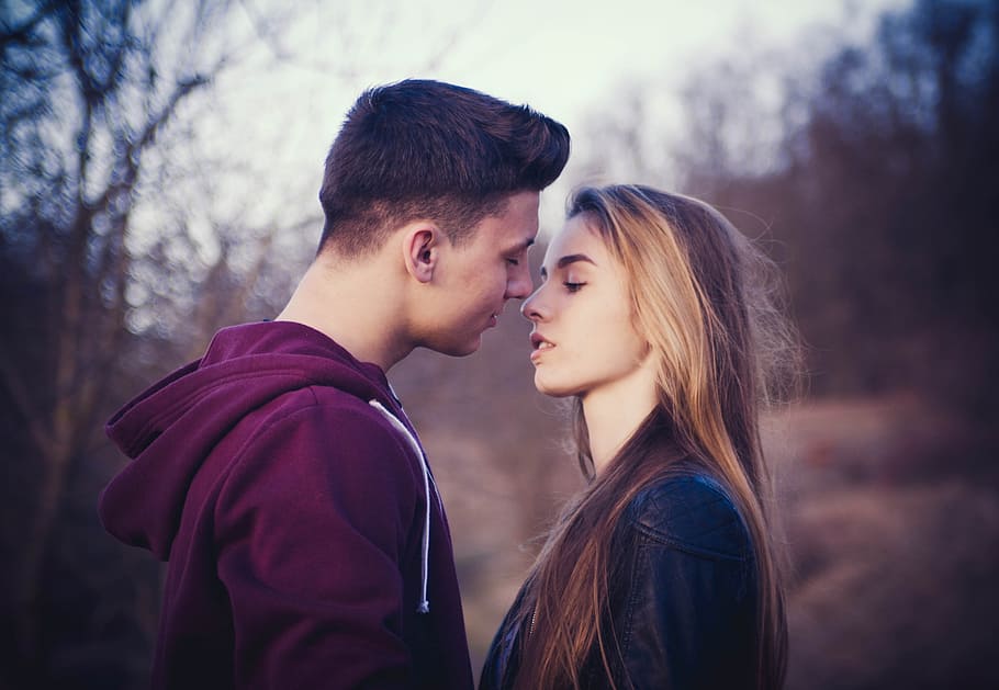 selective focus photo of man and woman about to kiss, portrait, HD wallpaper