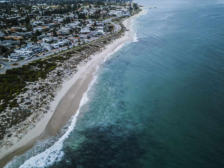 bird's eye view of beach line, bird's eye view photography of buildings on seashore HD wallpaper