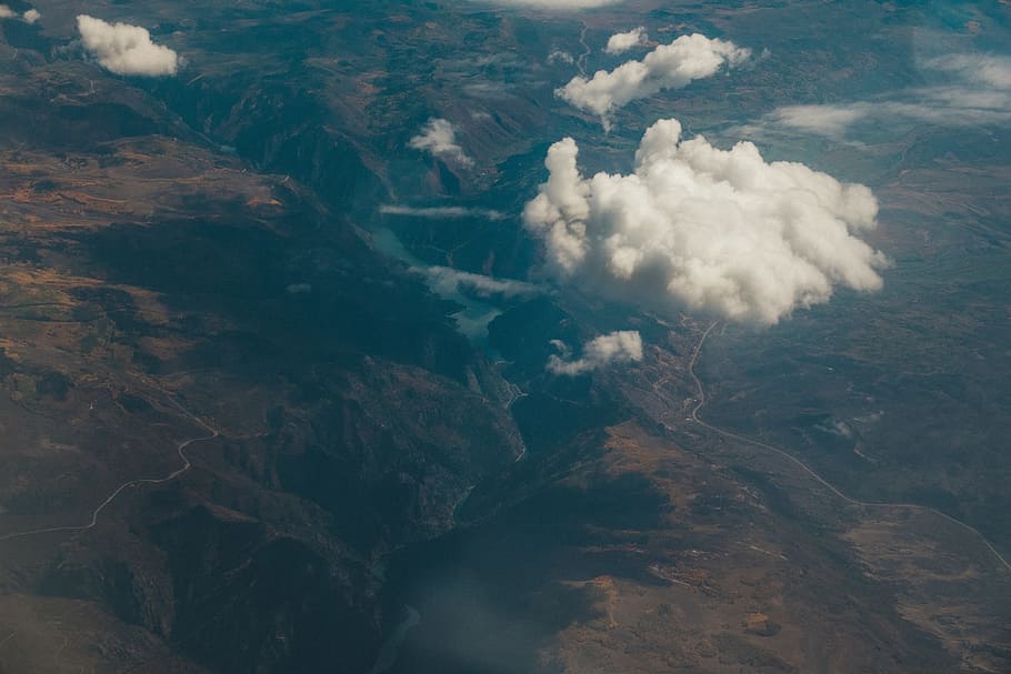 mountains, valleys, hills, cliffs, aerial, view, sky, clouds HD wallpaper