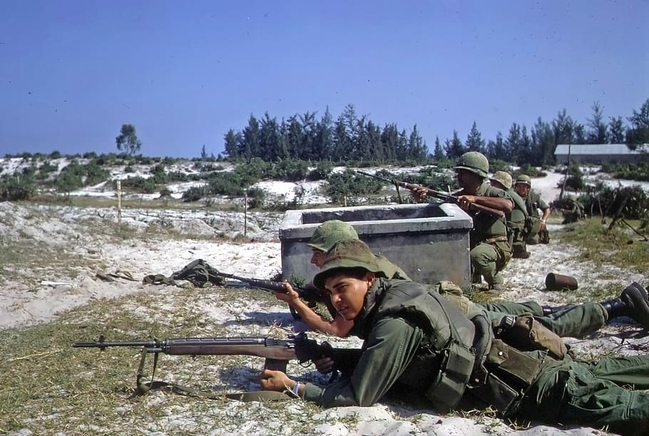 U.S. Marines with M14 rifles battle in Hamo village in Vietnam War