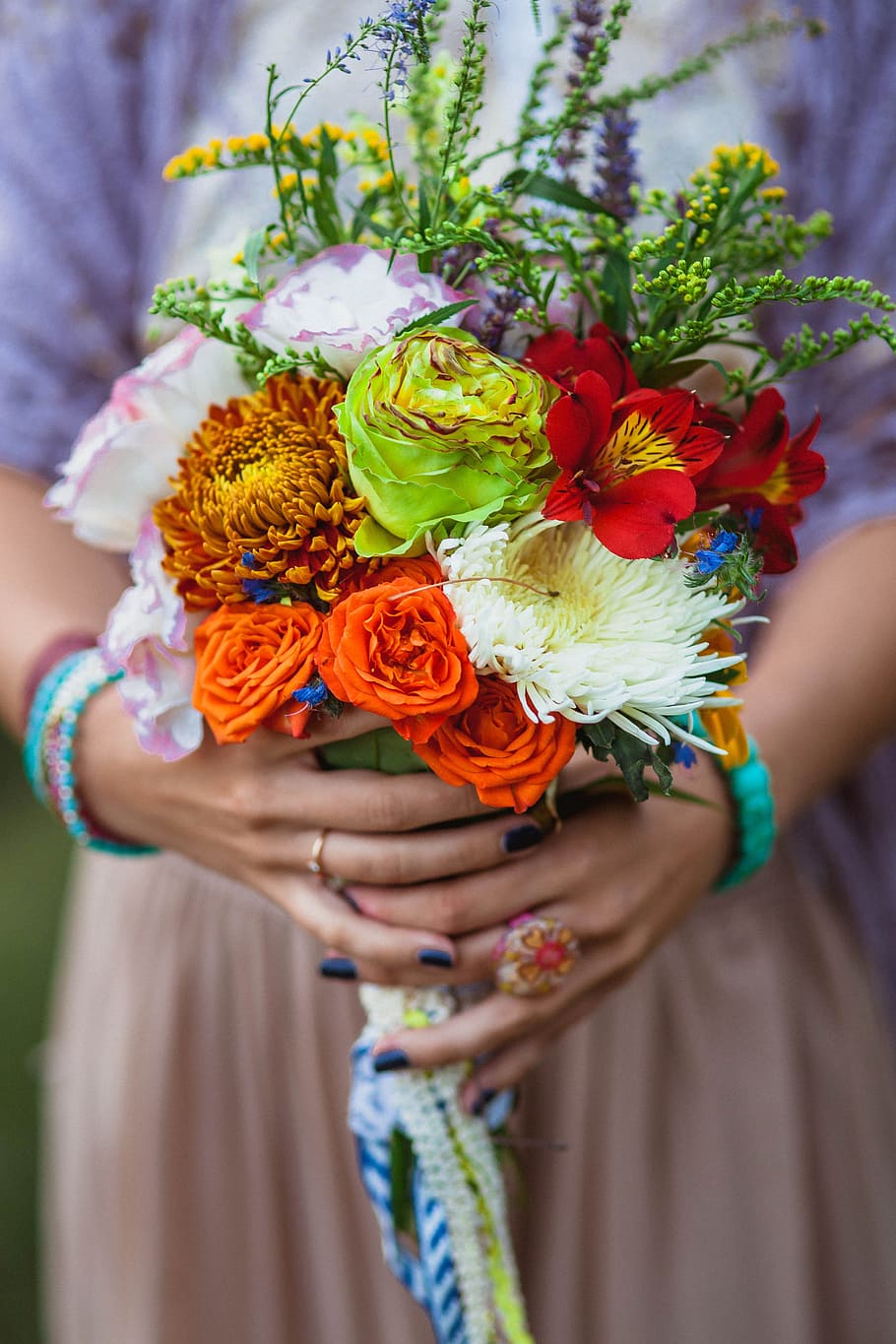 woman in purple and orange dress holding variety of flower bouquet HD wallpaper