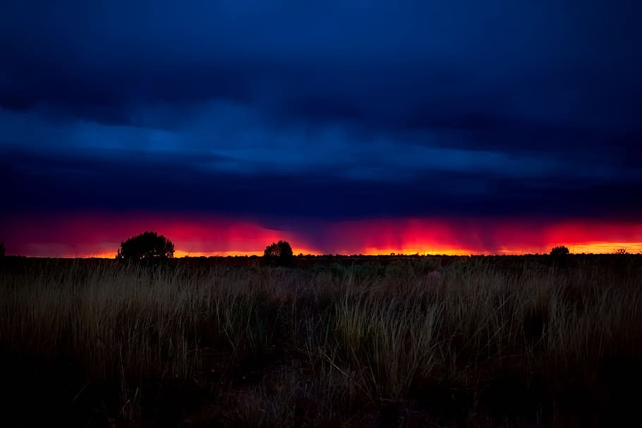 green grass field, storm, rain, sunset, dusk, landscape, sky HD wallpaper