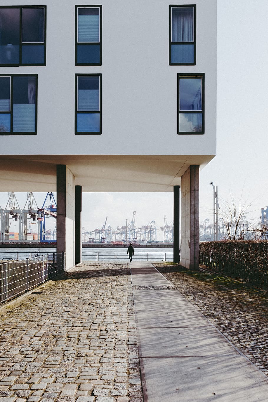 Man walking in front of the port of Hamburg, architecture and Cityscape HD wallpaper