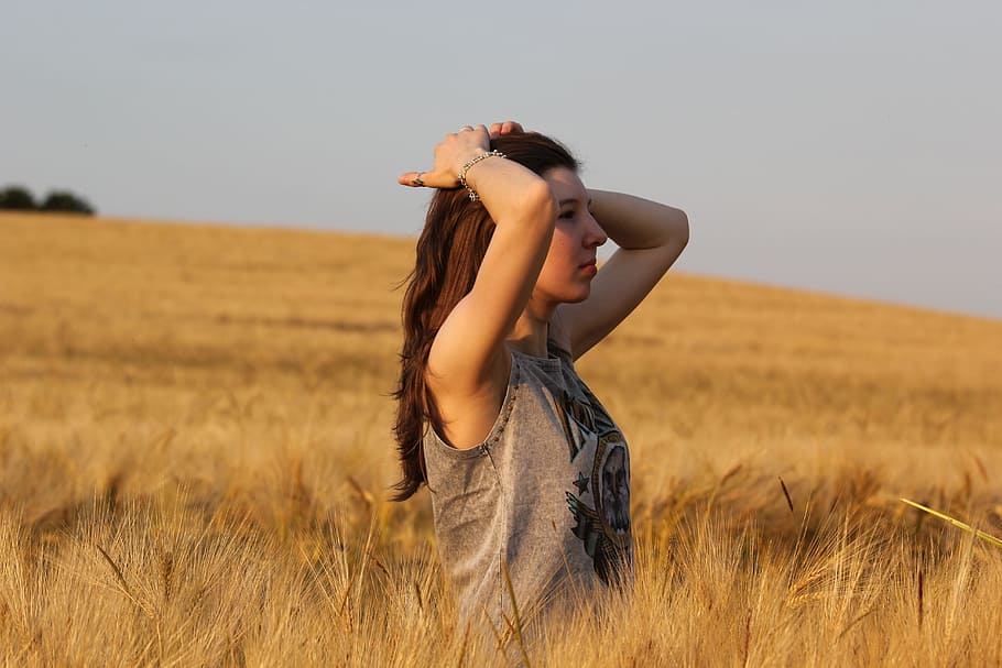woman standing on brown tall grass during daytime, human, cornfield HD wallpaper