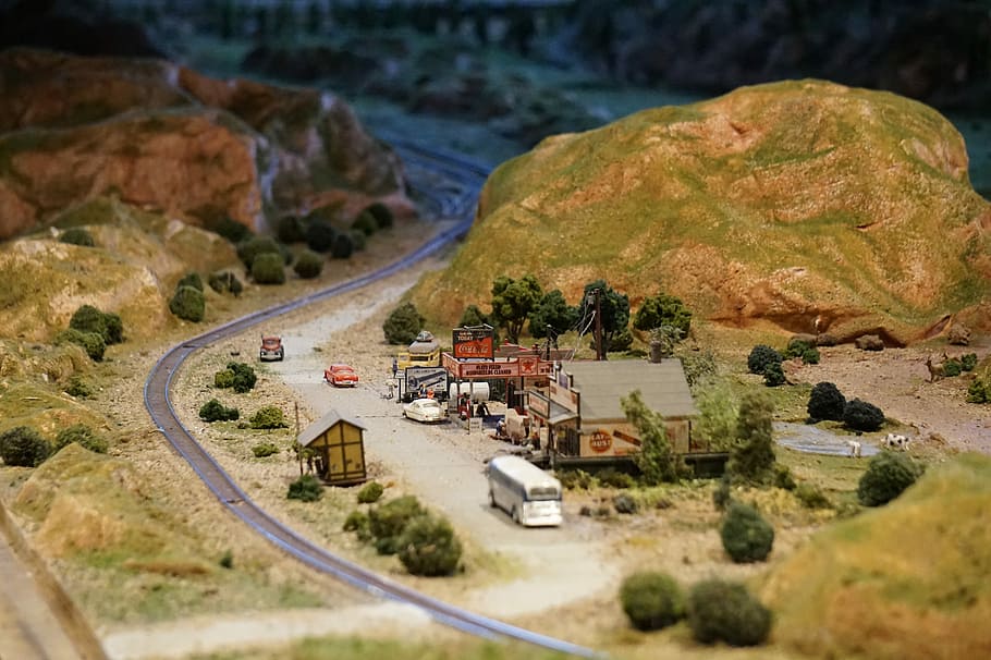 miniature town beside mountain and highway, village near mountain miniature set HD wallpaper
