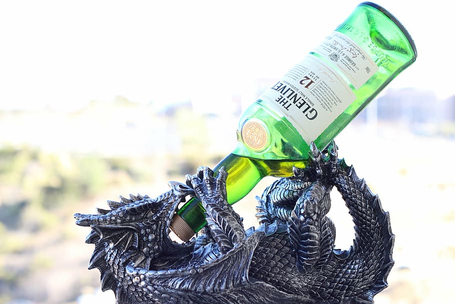 gray dragon bottle holder with green translucent glass beverage bottle HD wallpaper