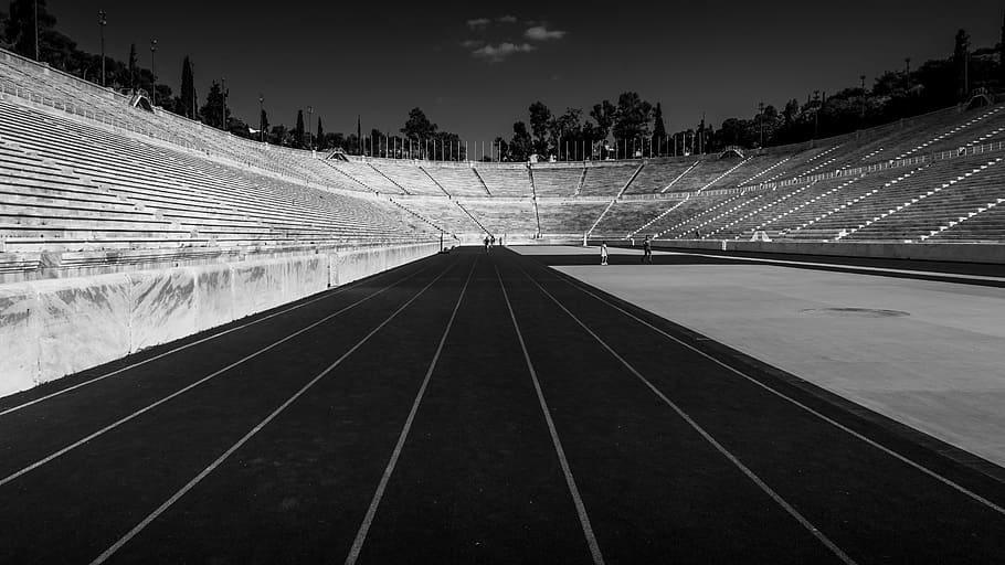 grayscale of stadium at night, grayscale photo of track field